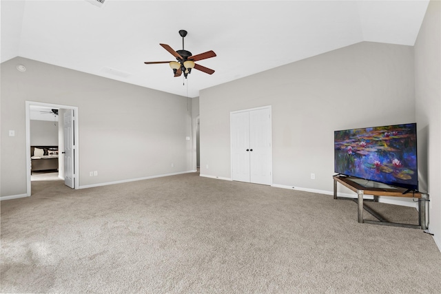 22726 Little Blue Stem Dr, Tomball, TX 77375 - unfurnished living room featuring ceiling fan, vaulted ceiling, carpet, and baseboards