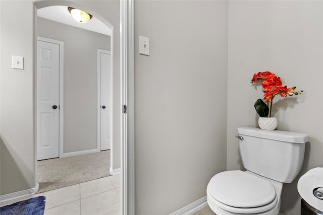 22726 Little Blue Stem Dr, Tomball, TX 77375 - bathroom featuring toilet, baseboards, and tile patterned floors