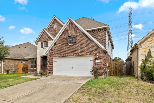 22726 Little Blue Stem Dr, Tomball, TX 77375 - traditional home featuring a front lawn, brick siding, driveway, and fence