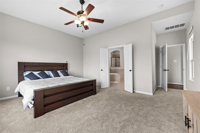 22726 Little Blue Stem Dr, Tomball, TX 77375 - bedroom with light colored carpet, baseboards, ensuite bath, and ceiling fan