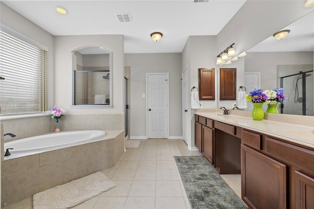 22726 Little Blue Stem Dr, Tomball, TX 77375 - bathroom featuring a shower stall, tile patterned floors, a garden tub, and a sink