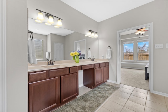 22726 Little Blue Stem Dr, Tomball, TX 77375 - full bath with a sink, double vanity, baseboards, and tile patterned floors