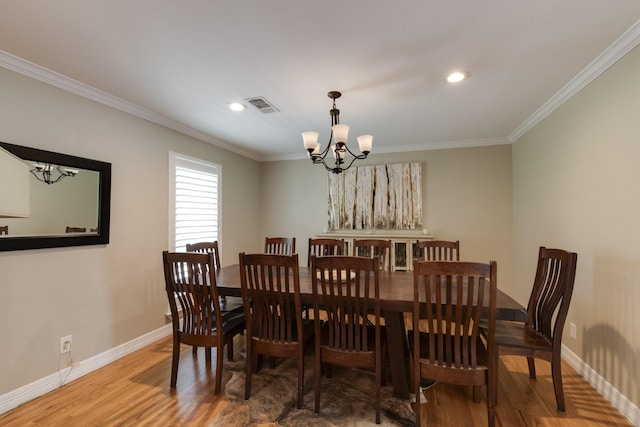 11107 Atwell Dr, Houston, TX 77096 - dining room with wood finished floors, a chandelier, crown molding, baseboards, and recessed lighting