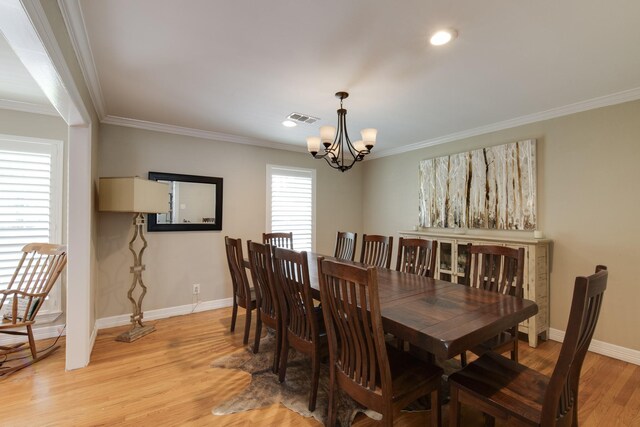 11107 Atwell Dr, Houston, TX 77096 - dining space featuring a chandelier, ornamental molding, light wood-style flooring, baseboards, and recessed lighting