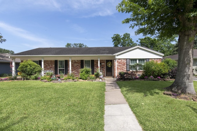 11107 Atwell Dr, Houston, TX 77096 - single story home with a front yard, brick siding, and covered porch