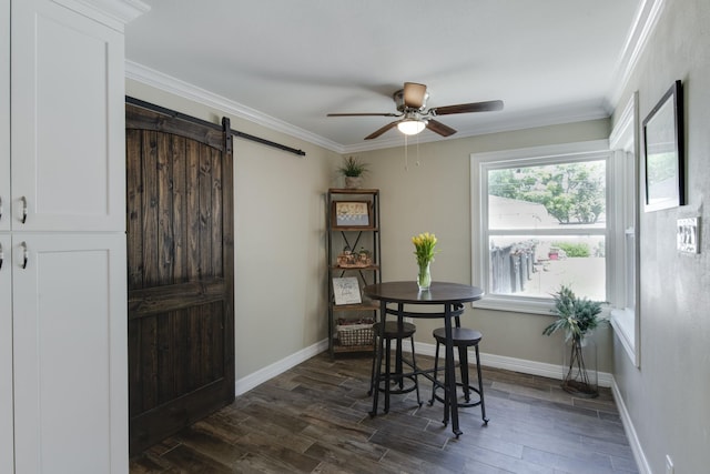 11107 Atwell Dr, Houston, TX 77096 - dining room featuring a barn door, a ceiling fan, crown molding, dark wood-type flooring, and baseboards