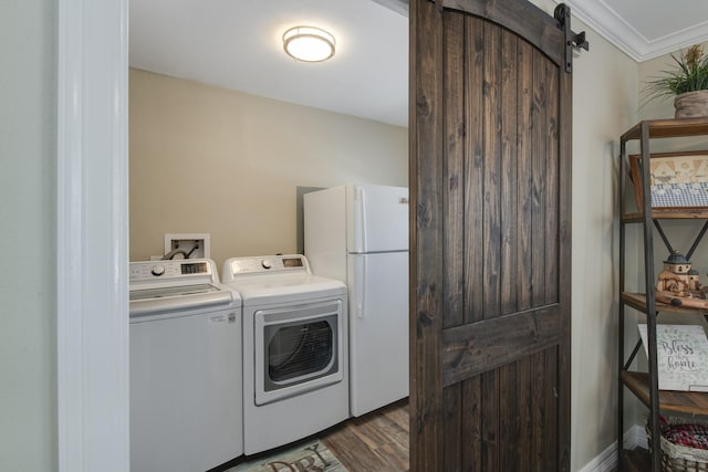 11107 Atwell Dr, Houston, TX 77096 - laundry room with dark wood finished floors, independent washer and dryer, a barn door, and crown molding