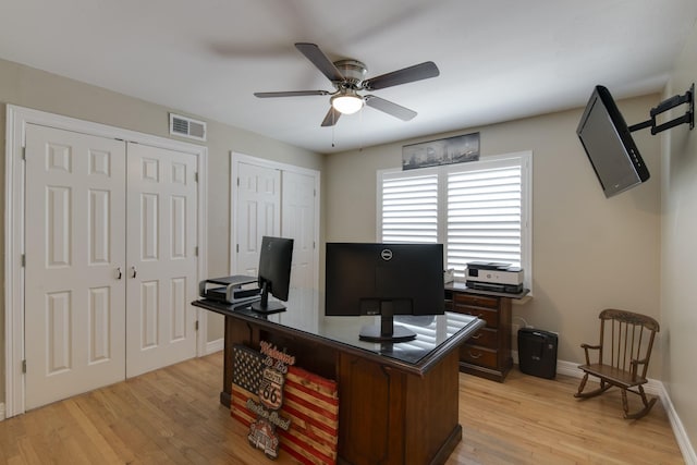 11107 Atwell Dr, Houston, TX 77096 - home office featuring ceiling fan, light wood-style flooring, and baseboards