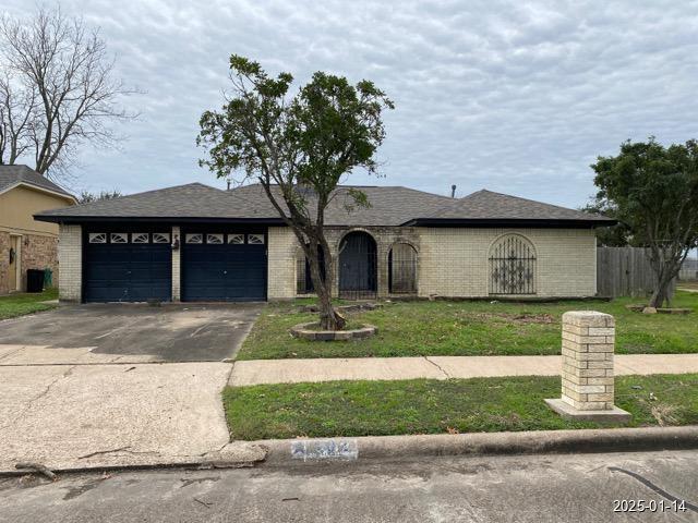 402 Boone Ct, Deer Park, TX 77536 - single story home with a garage, concrete driveway, and brick siding