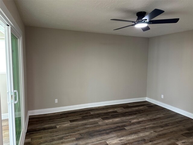 402 Boone Ct, Deer Park, TX 77536 - spare room with dark wood-style flooring, ceiling fan, and baseboards