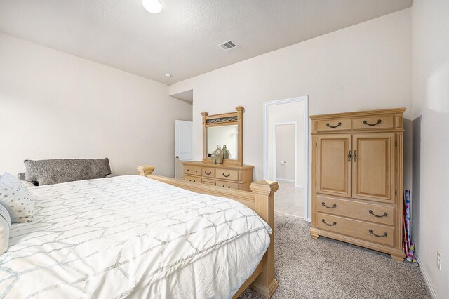 bedroom with light carpet