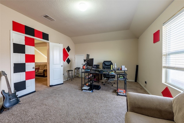 office area featuring carpet and vaulted ceiling