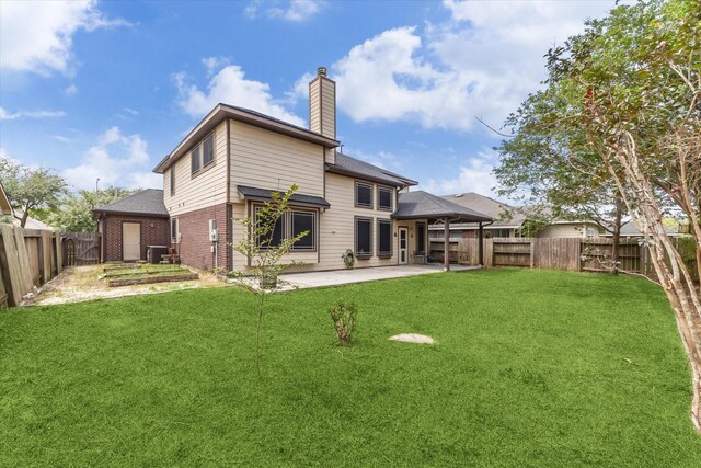 back of house featuring a patio area, a chimney, central AC, roof with shingles, and brick siding