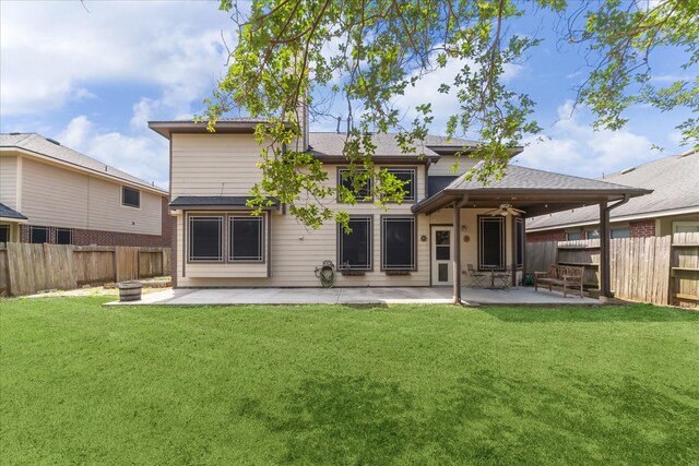 back of house with a patio, an outdoor fire pit, a ceiling fan, and roof with shingles