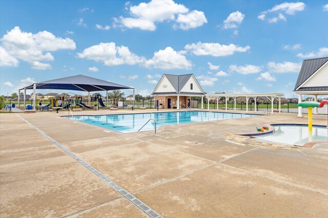community pool featuring a patio area and fence