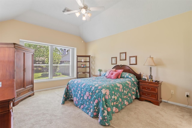 bedroom featuring light colored carpet, lofted ceiling, baseboards, and ceiling fan