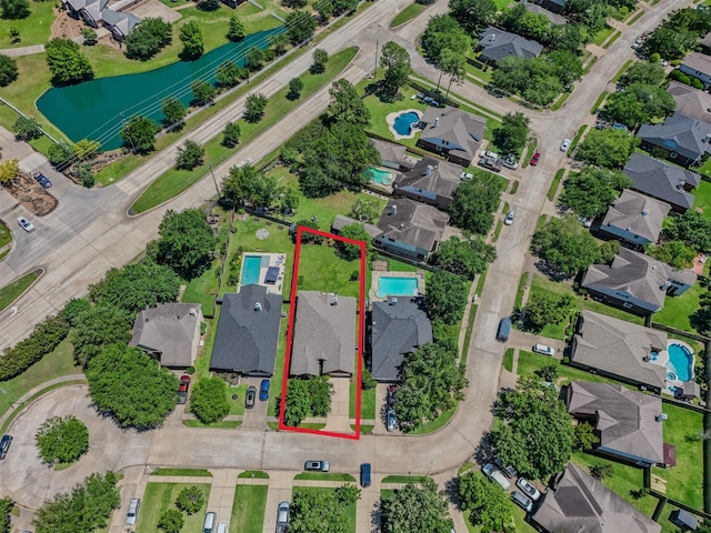 aerial perspective of suburban area featuring property parcel outlined and a large body of water