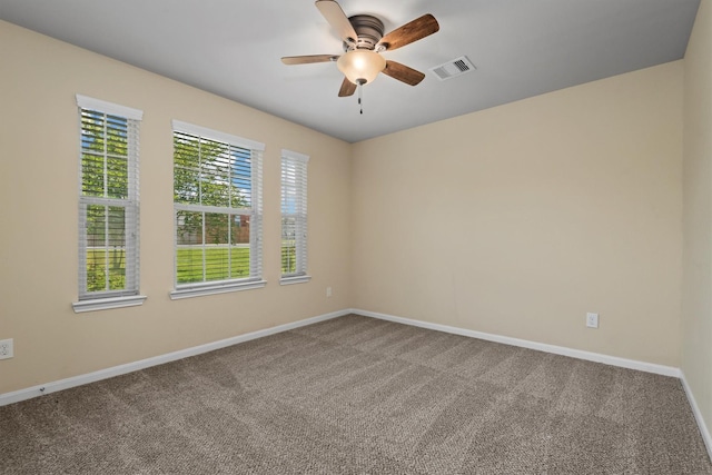 13228 Miller Ln, Willis, TX 77318 - carpeted spare room featuring baseboards and a ceiling fan