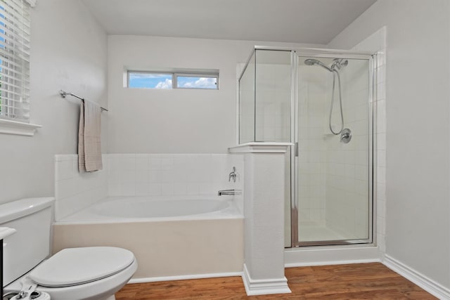 13228 Miller Ln, Willis, TX 77318 - full bathroom with toilet, a shower stall, and wood finished floors