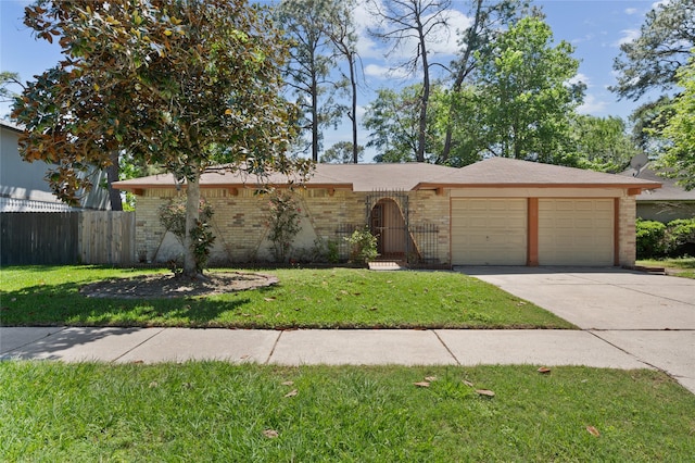 single story home with a garage, driveway, and brick siding