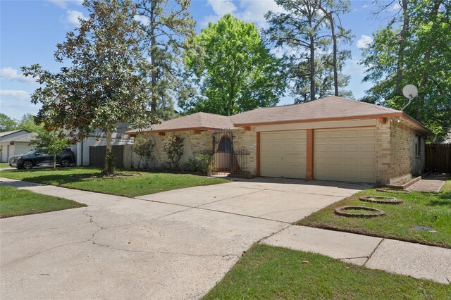 ranch-style house featuring brick siding, a garage, and driveway