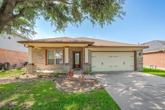 ranch-style house featuring brick siding, an attached garage, and driveway