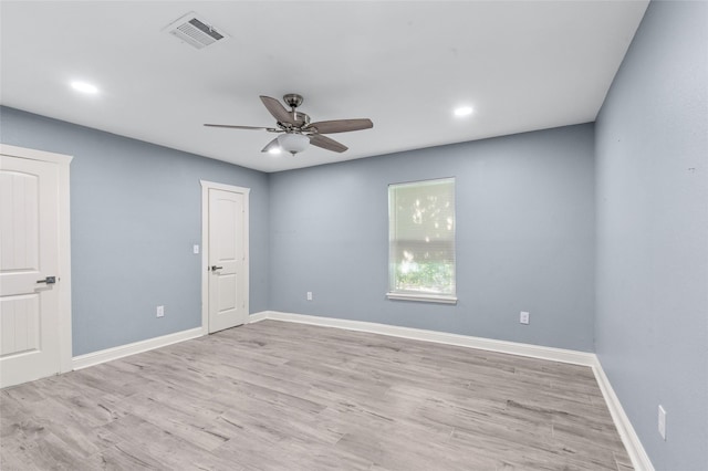 unfurnished room with ceiling fan, baseboards, light wood-type flooring, and recessed lighting