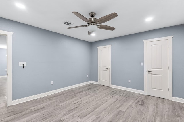 empty room with a ceiling fan, wood finished floors, baseboards, and recessed lighting