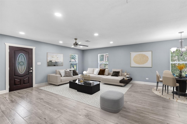3853 Rosedale St, Houston, TX 77004 - living area with recessed lighting, wood finished floors, plenty of natural light, a chandelier, and ceiling fan