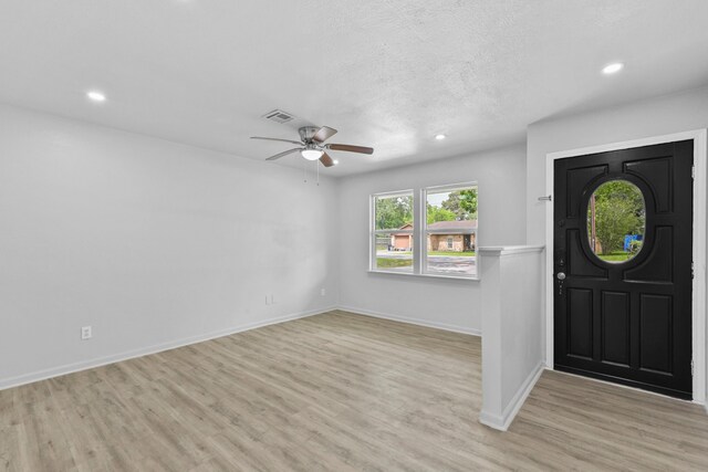 foyer entrance with light wood-type flooring, recessed lighting, ceiling fan, and baseboards