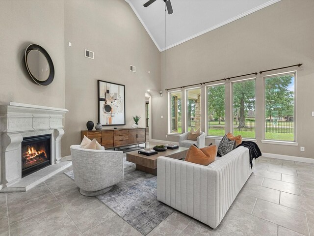 20722 Lavone Dr, Porter, TX 77365 - living area with crown molding, high vaulted ceiling, a ceiling fan, a fireplace, and baseboards