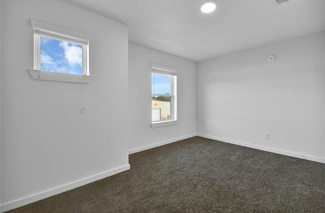 12603 Telge Rd Unit 11E-F, Cypress, TX 77429 - empty room featuring dark carpet and baseboards