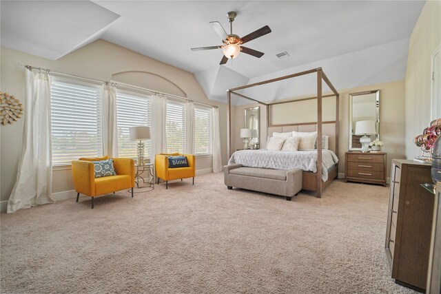 bedroom featuring vaulted ceiling, light carpet, baseboards, and ceiling fan