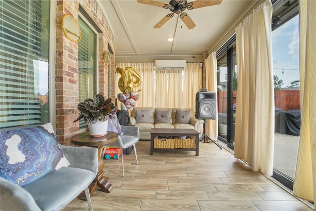 sunroom with a wall mounted AC and healthy amount of natural light