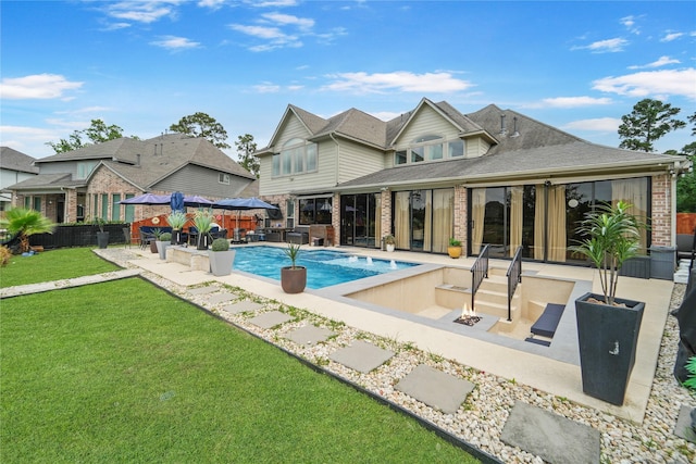 back of property with a patio area, brick siding, a gazebo, and a shingled roof