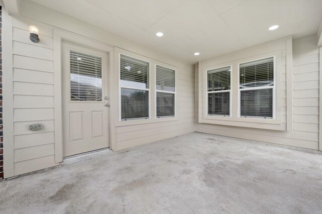 entrance to property featuring a patio area