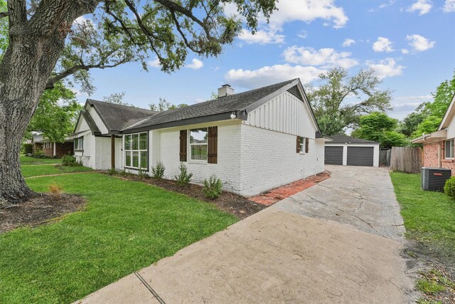 5927 Warm Springs Rd, Houston, TX 77035 - view of side of home with brick siding, a chimney, central air condition unit, an outbuilding, and a detached garage