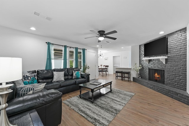 5927 Warm Springs Rd, Houston, TX 77035 - living area with a ceiling fan, a fireplace, wood finished floors, and recessed lighting