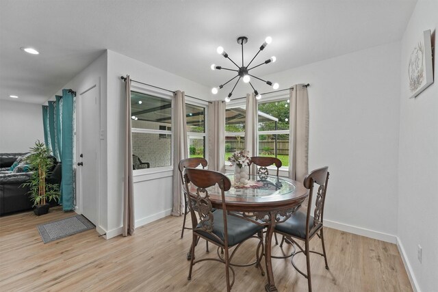 5927 Warm Springs Rd, Houston, TX 77035 - dining area with a chandelier, light wood-type flooring, baseboards, and recessed lighting