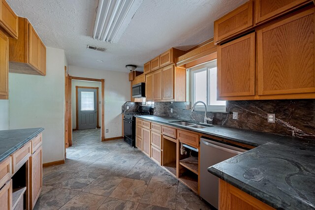 kitchen featuring appliances with stainless steel finishes, a sink, backsplash, baseboards, and open shelves