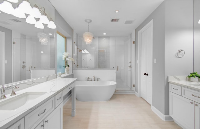 9803 White Rock Lake Trl, Cypress, TX 77433 - bathroom with a shower stall, vanity, a soaking tub, and recessed lighting