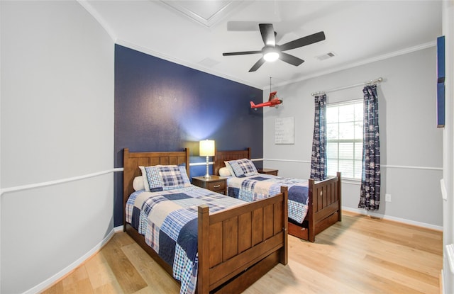 9803 White Rock Lake Trl, Cypress, TX 77433 - bedroom featuring wood finished floors, ornamental molding, baseboards, and a ceiling fan