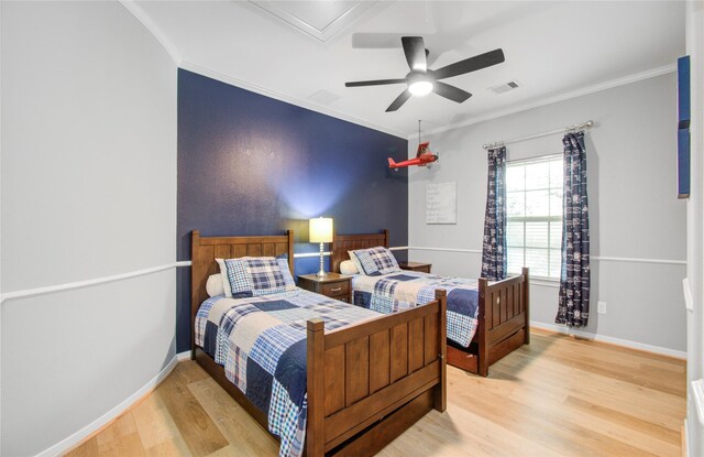 9803 White Rock Lake Trl, Cypress, TX 77433 - bedroom featuring wood finished floors, ornamental molding, and a ceiling fan