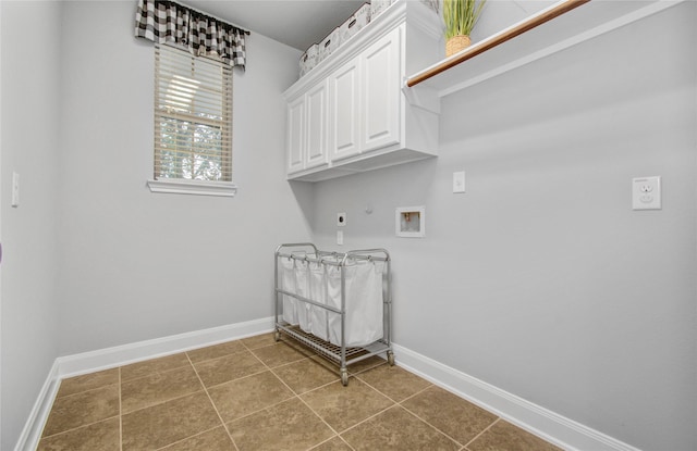 9803 White Rock Lake Trl, Cypress, TX 77433 - laundry room with washer hookup, cabinet space, gas dryer hookup, baseboards, and hookup for an electric dryer