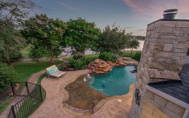 9803 White Rock Lake Trl, Cypress, TX 77433 - pool at dusk with a patio area