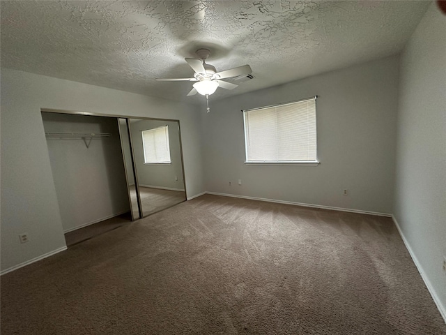 2934 Poplar Creek Ln, Pearland, TX 77584 - unfurnished bedroom featuring carpet flooring, a closet, baseboards, a textured ceiling, and ceiling fan