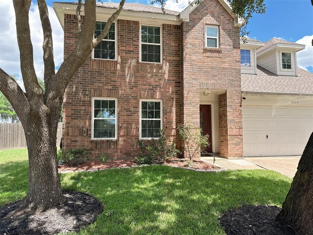 8535 Morning Oak Ln, Cypress, TX 77433 - view of front of home with a garage and brick siding