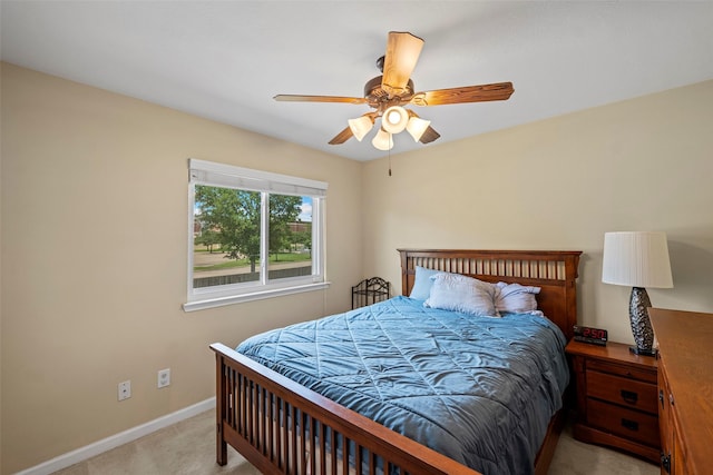 8535 Morning Oak Ln, Cypress, TX 77433 - bedroom featuring light carpet, baseboards, and a ceiling fan