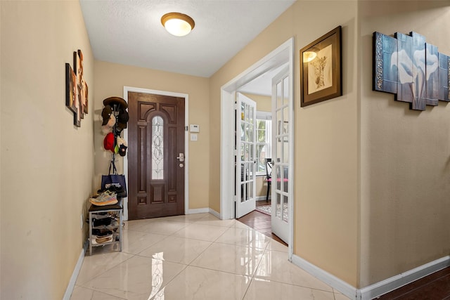 8535 Morning Oak Ln, Cypress, TX 77433 - foyer with baseboards, french doors, and a textured ceiling