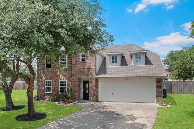 8535 Morning Oak Ln, Cypress, TX 77433 - view of front of house with a shingled roof, driveway, brick siding, a garage, and cooling unit